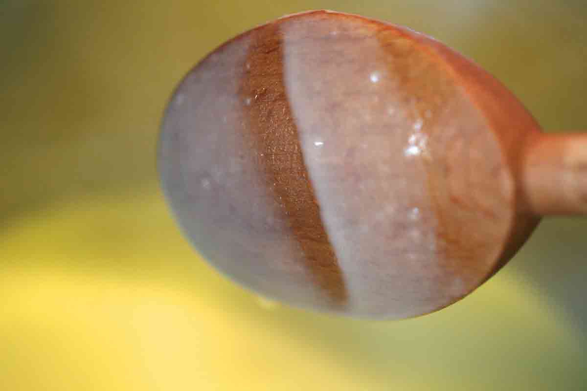 Spoon with eggnog ice cream coating 