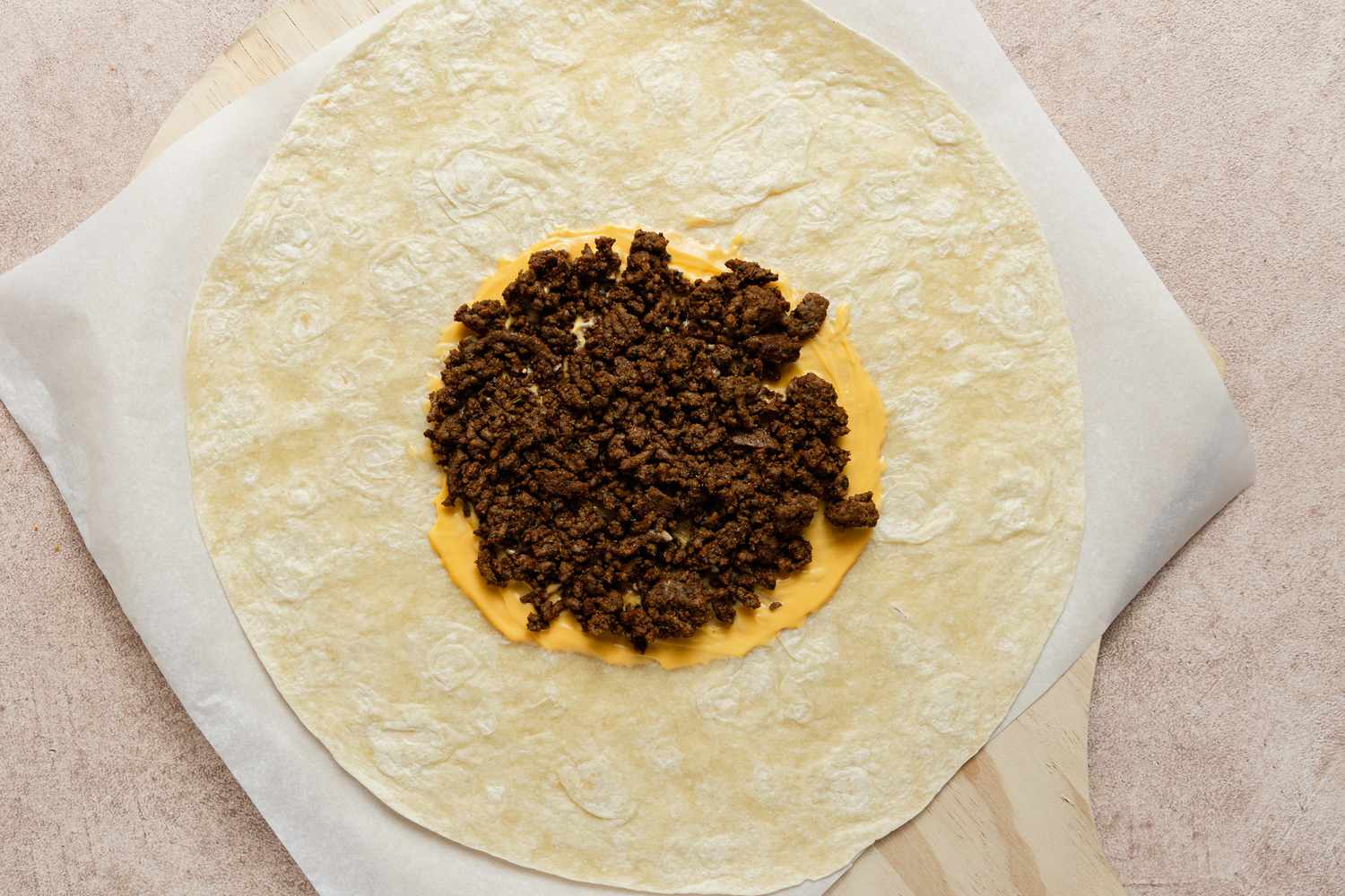 Beef and Cheese Added to Tortilla for Crunchwrap Supreme Copycat 