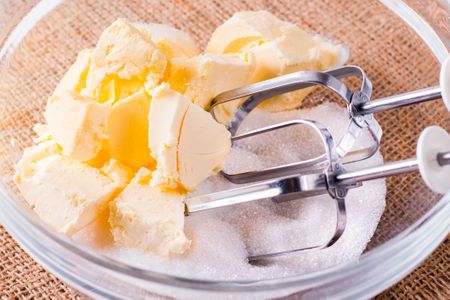 Butter and sugar in a bowl with a mixer