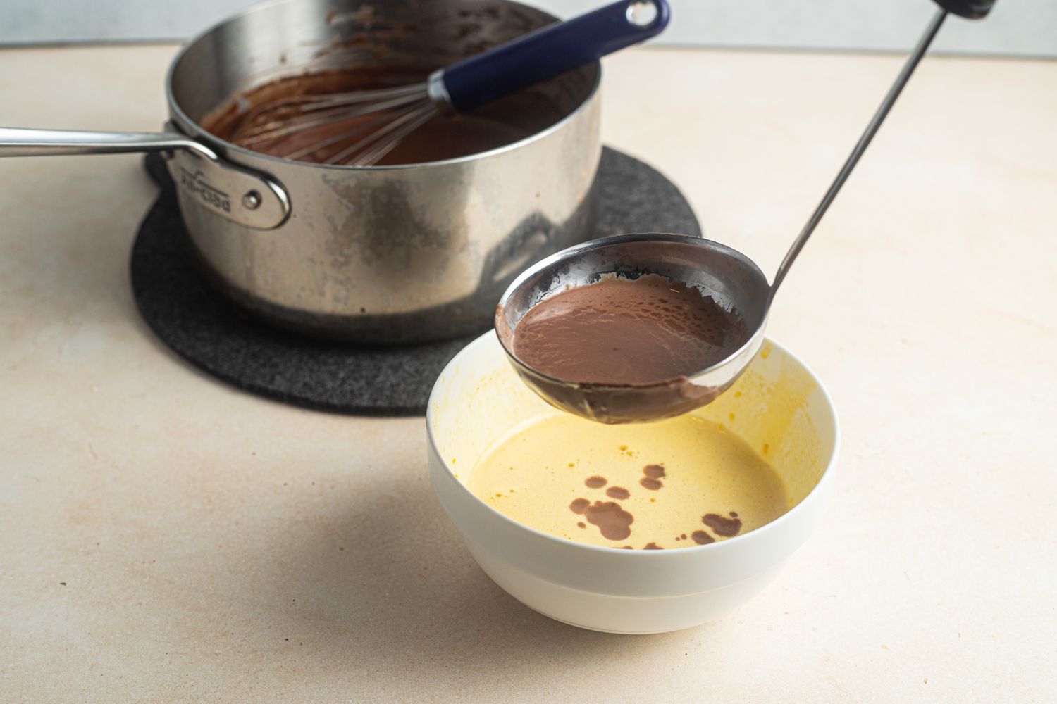 Melted Chocolate Ladled into Whipped Egg Yolks for Chocolate Pots de Creme