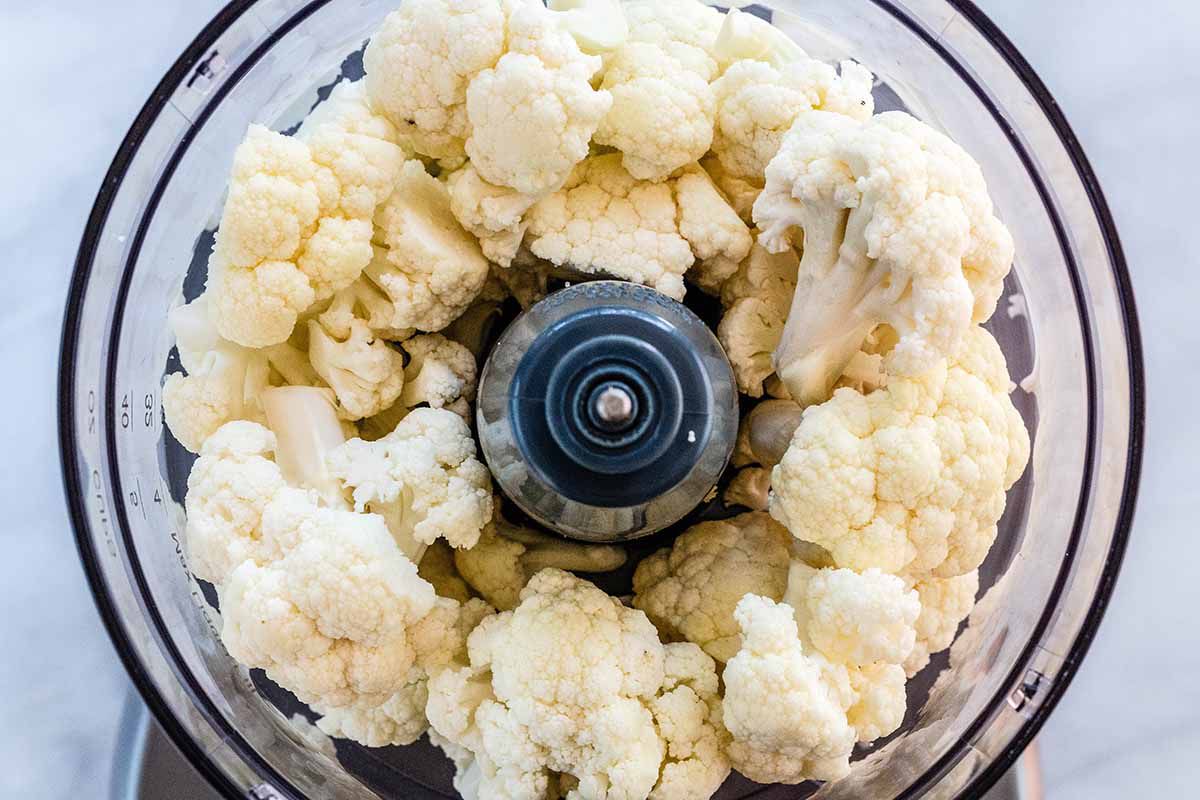 How to Make Rice from Cauliflower add the cauliflower to the food processor