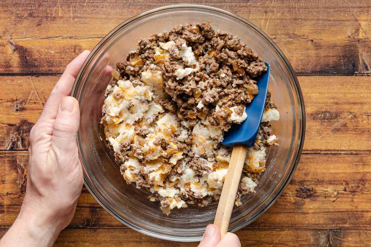 cooked ground beef mixed with the cheesy potato filling for cheeseburger stuffed baked potatoes recipe 