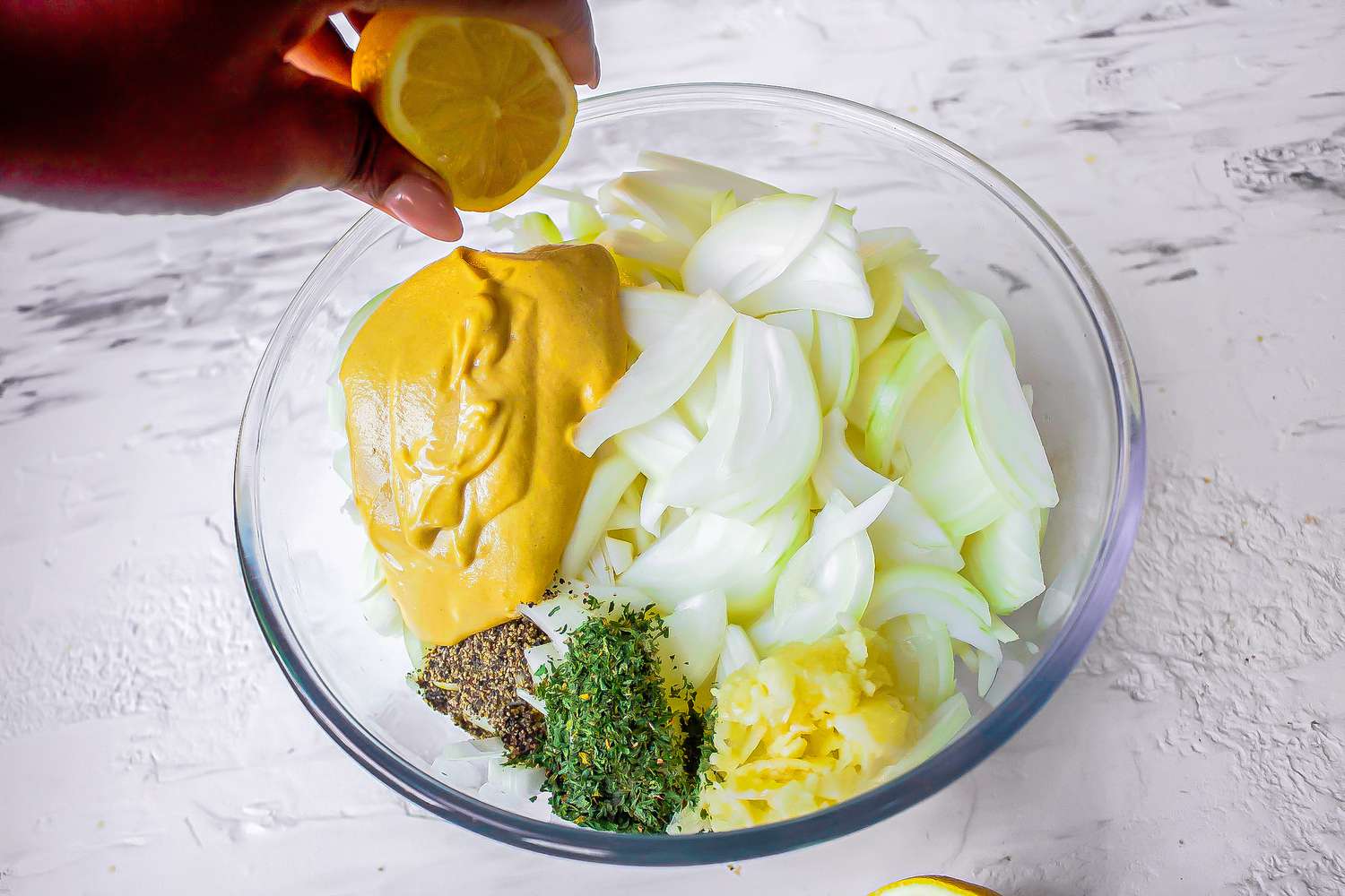 Combining mustard with onions for sauce for chicken yassa recipe