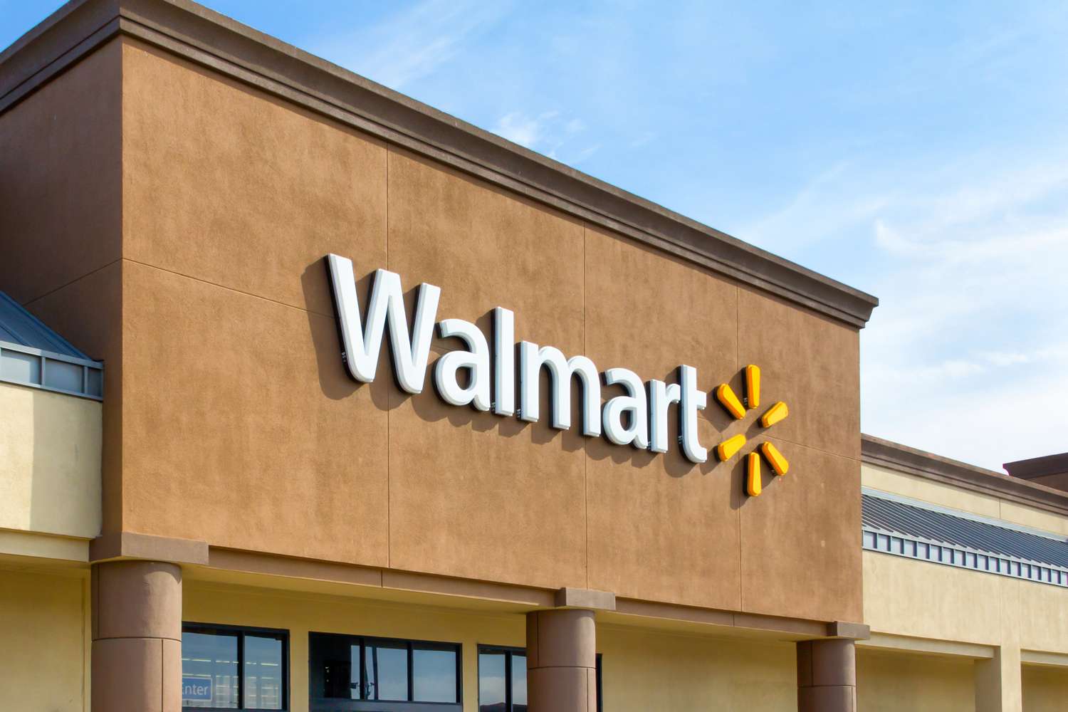 Facade of a Walmart store with the company logo displayed prominently on the building