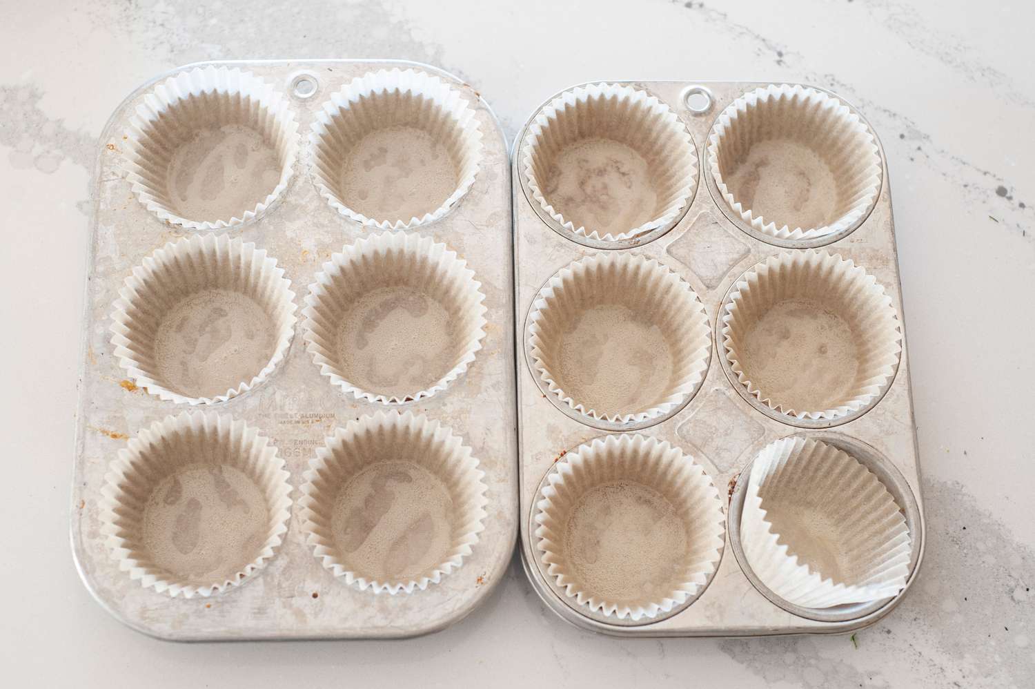 Line muffin tins with muffin liners.