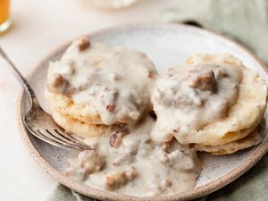 Biscuits and gravy on a plate.