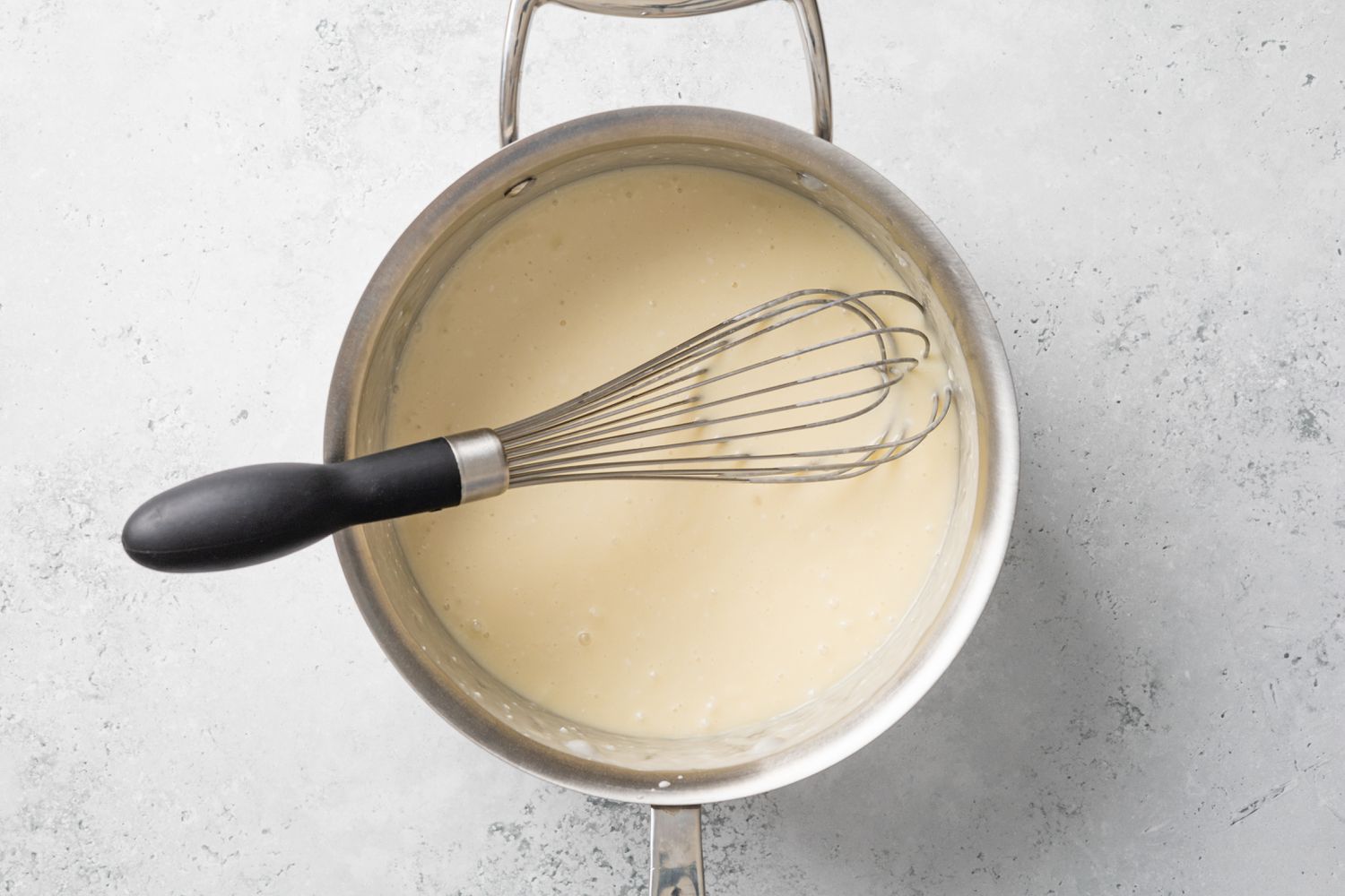 Liquid Ingredients Added and Whisked in Sauce Pan for Piña Colada Pie Recipe 