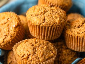 Bran muffins in a table napkin lined basket