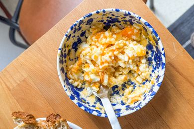 overhead view of egg salad in a bowl with a spoon
