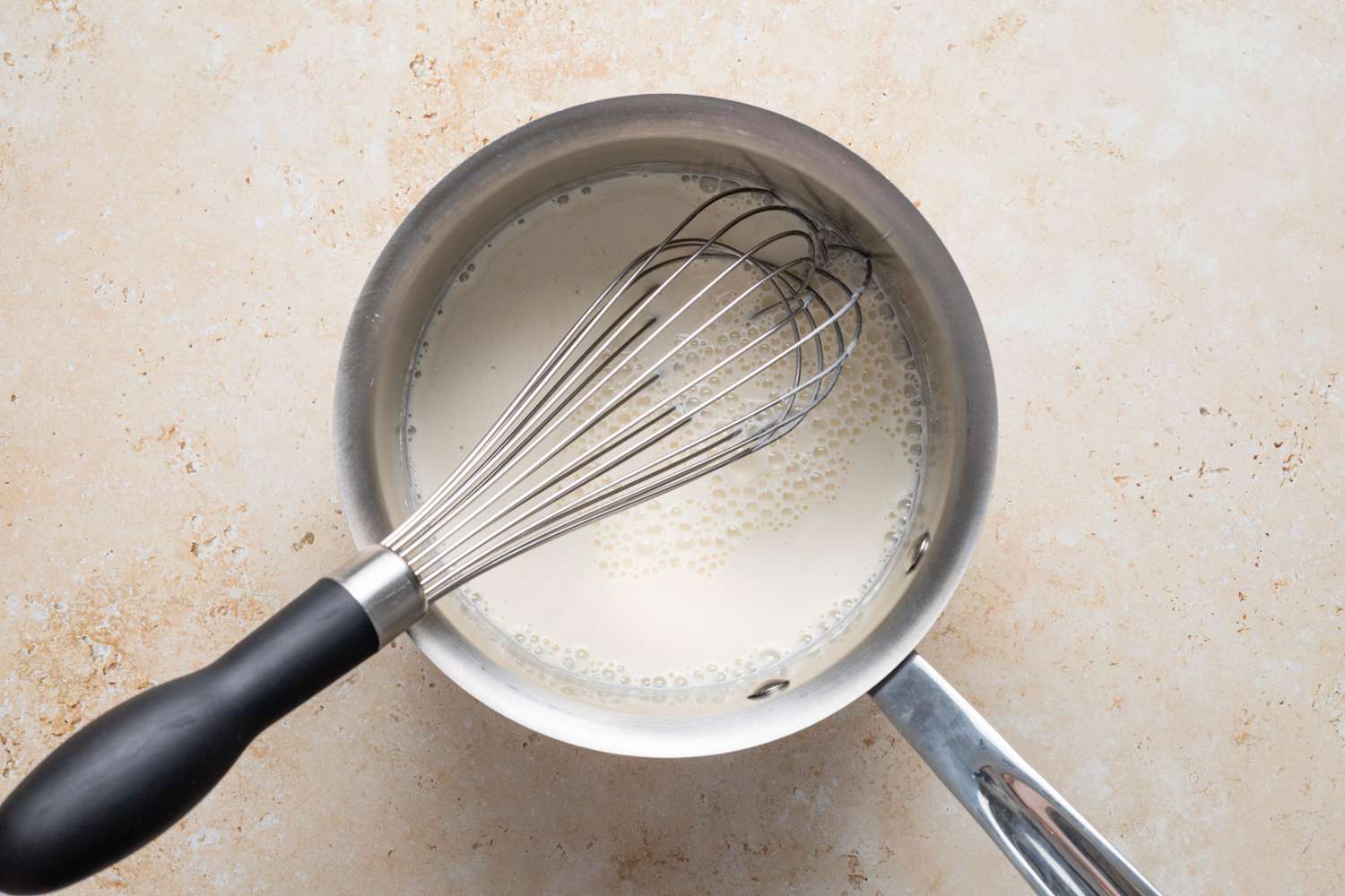Milk and Flour Whisked Together in Sauce Pan to Make Tangzhong for Milk Bread Rolls