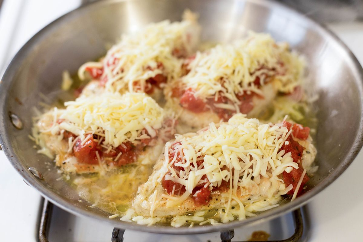 Top the chicken with tomato bruschetta topping and cheese