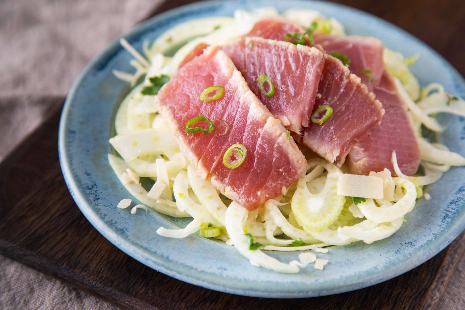 A plate of ahi tuna served over fennel salad.