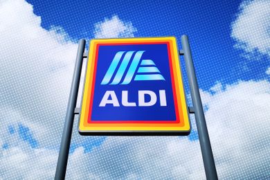 Aldi supermarket sign against a cloudy sky