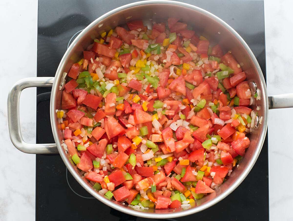 Puerto Rican Crab, Tomatoes, and Rice add the tomatoes