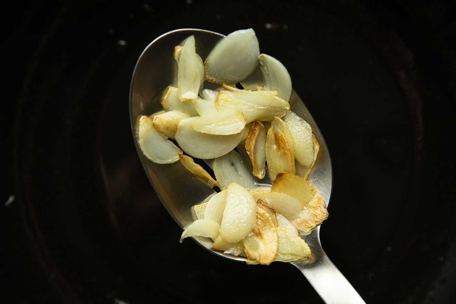 Cooked Garlic on a Spoon for Maitake Mushrooms with Garlic and Chile Oil Stir-Fry 