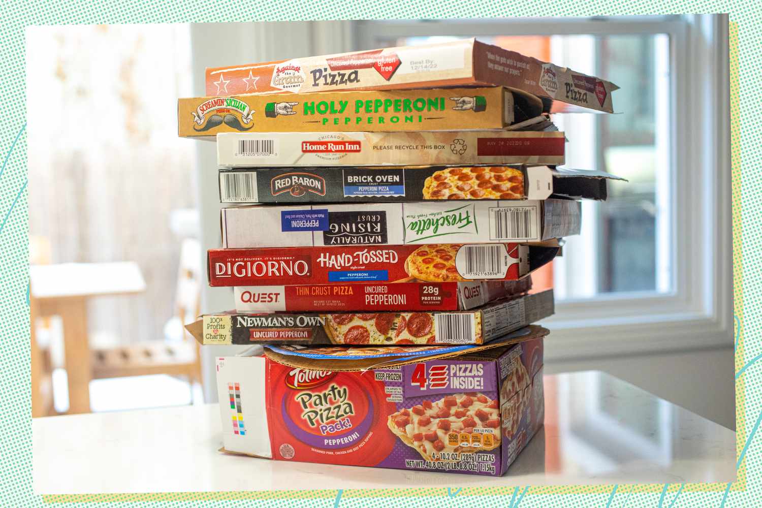 Boxes of frozen pizza staked on a counter