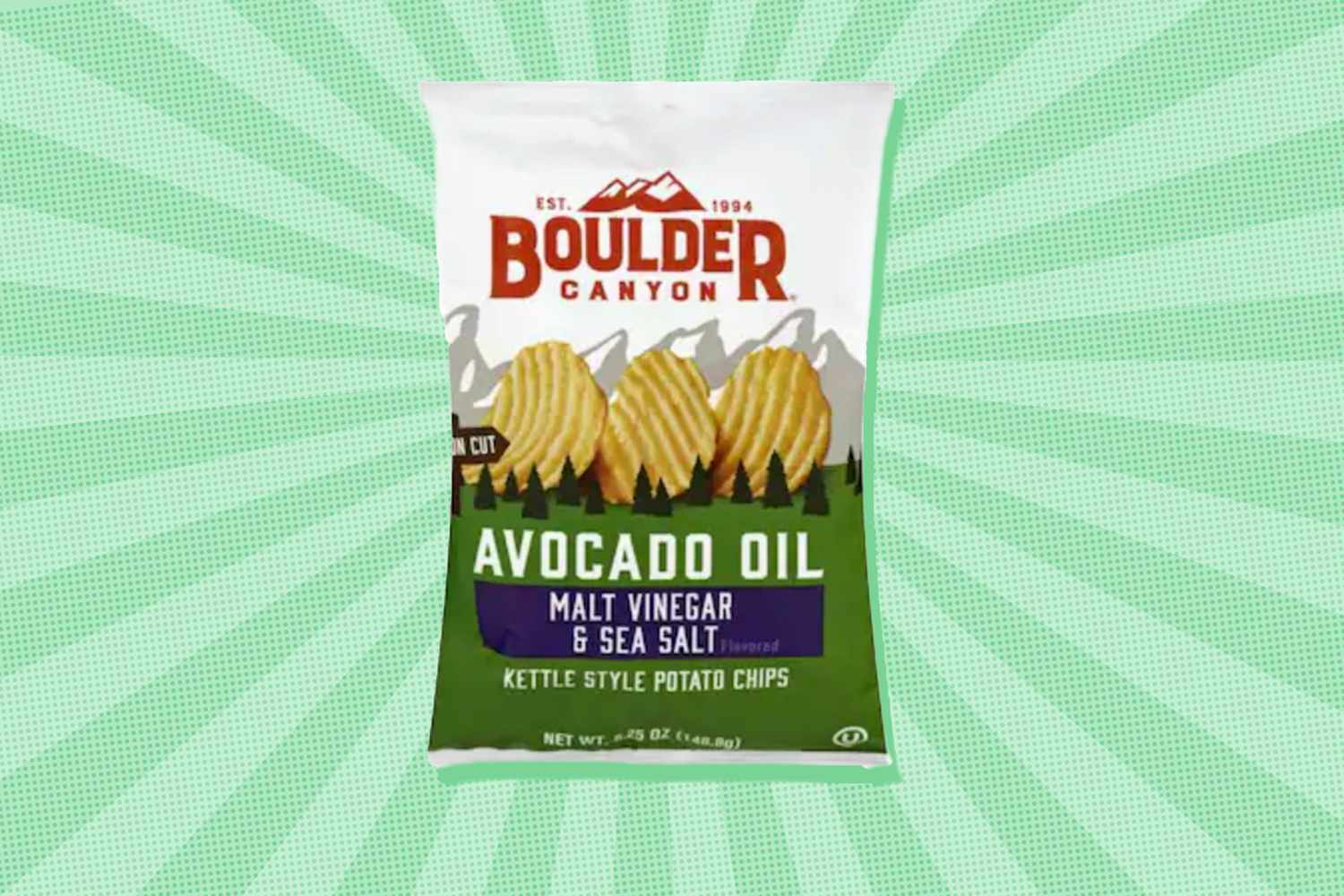 Bag of Boulder Canyon avocado oil kettle style potato chips malt vinegar and sea salt flavor on a patterned background