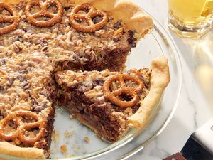 Texas trash pie in a pie dish with a slice cut out 
