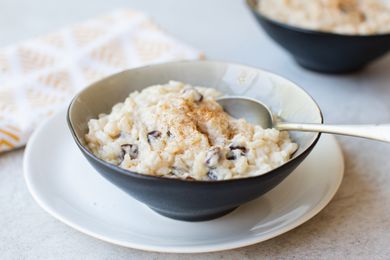 Rice Pudding with cinnamon sprinkled on top in a bowl 