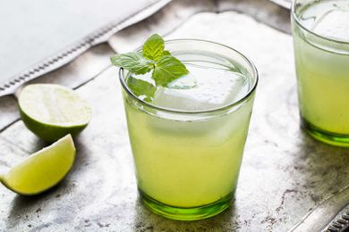 Easy Limeade in a glass with a mint sprig