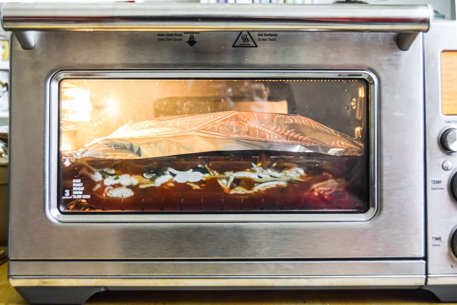 Aluminum Foil Covered Vegetarian Spinach and Mushroom Lasagna in the Oven 