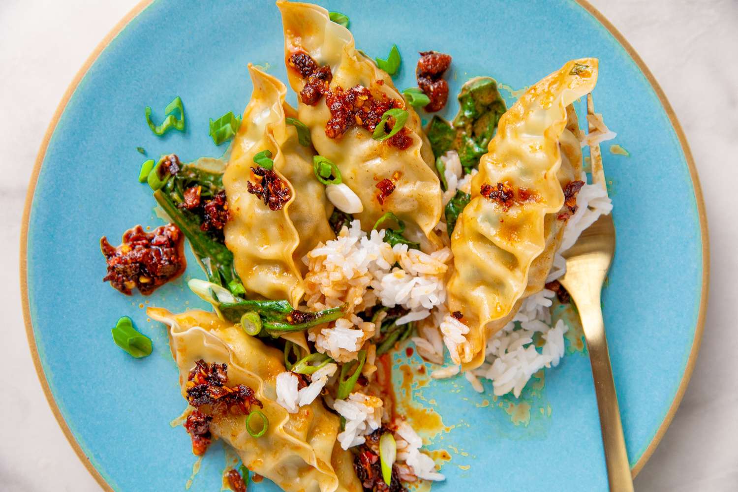 one serving of Dumpling Bake With Peanut Butter Sauce on a plate with a fork