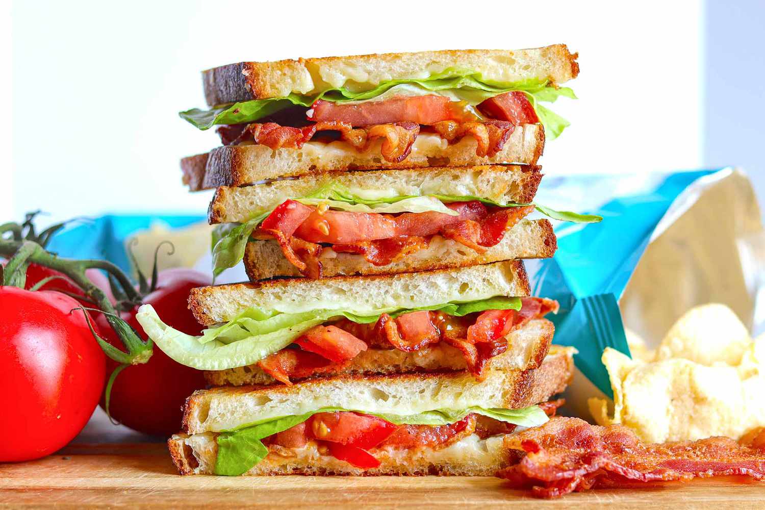 Four BLT Grilled Cheese sandwiches with toasty bread and crispy bacon