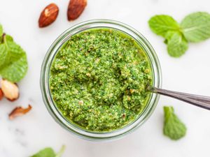 Mint and Almond Pesto - jar of mint pesto on white counter