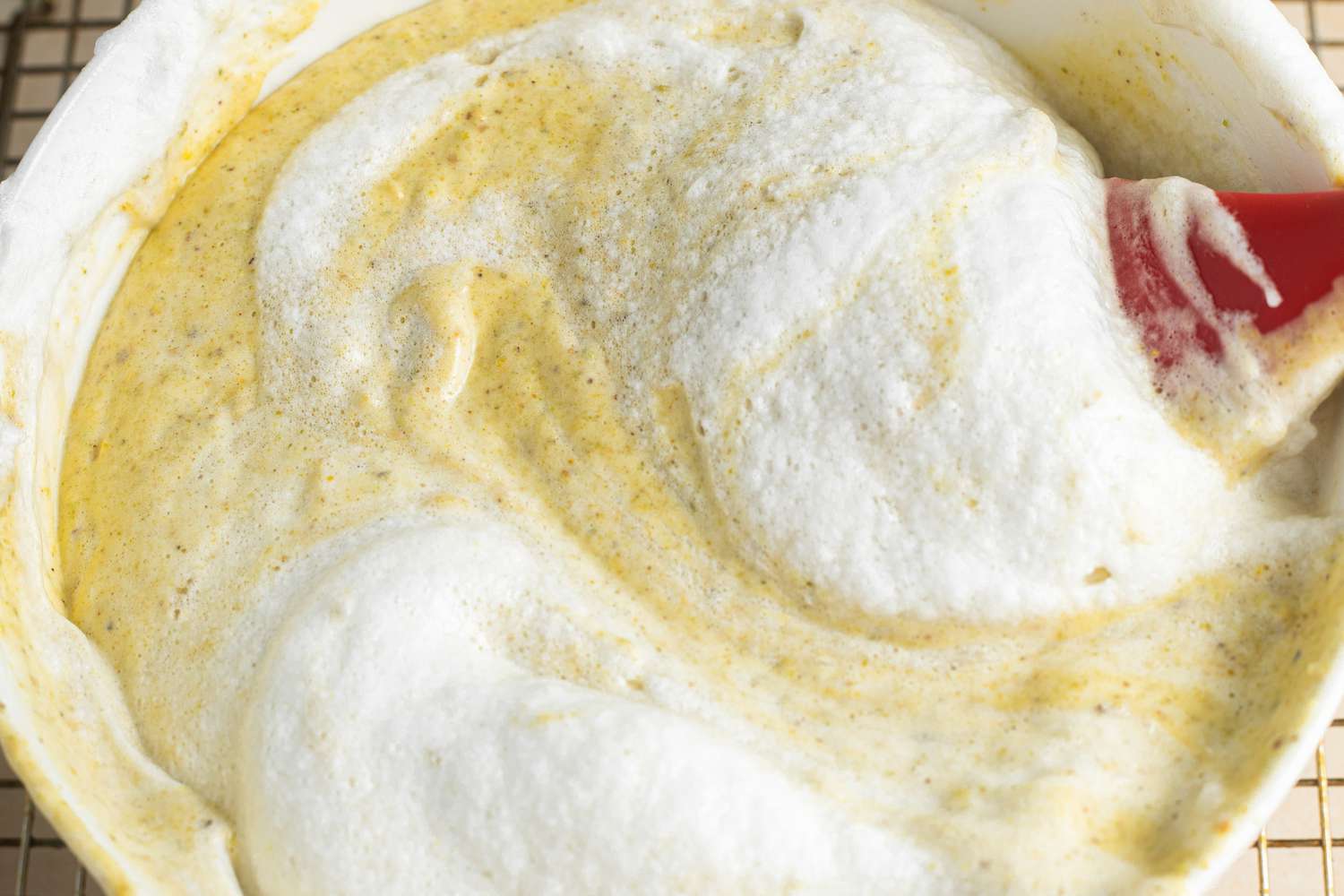 Egg Whites Folded into Pistachio Cardamom Tres Leches Cake Batter