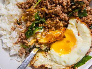 close up of a bowl of Beef Krapow bowl with a fried egg