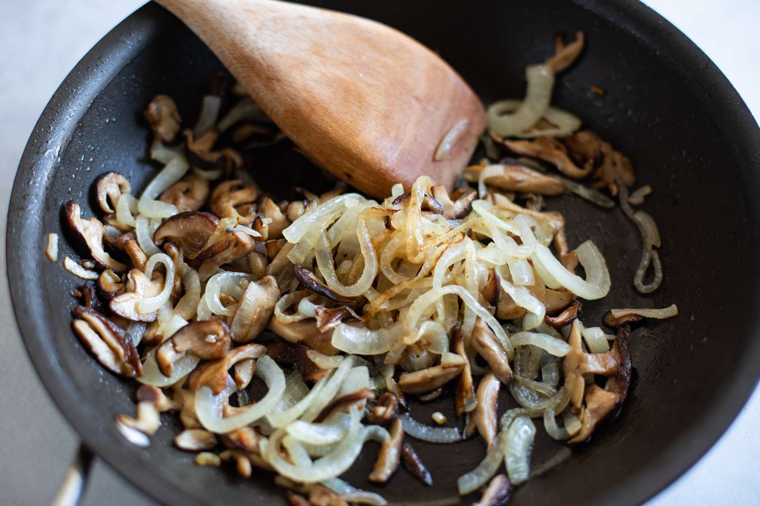 Sauteeing mushrooms for a ground beef and mushroom recipe.