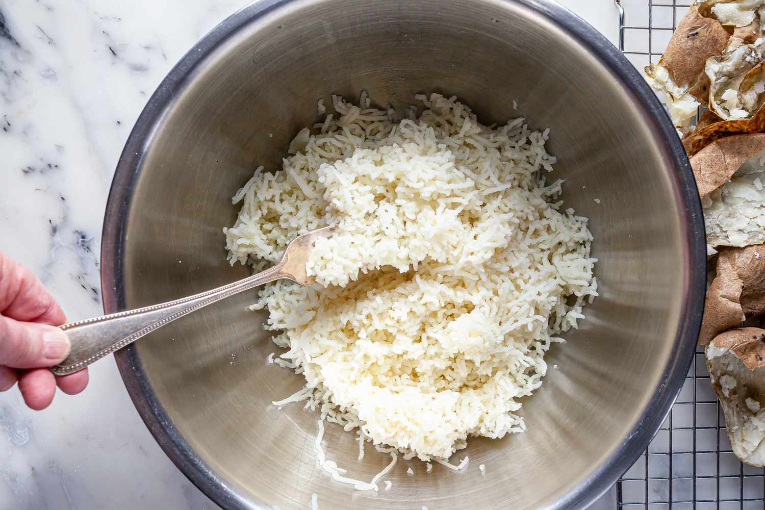 Riced potatoes in a bowl to make a Potato Gnocchi recipe