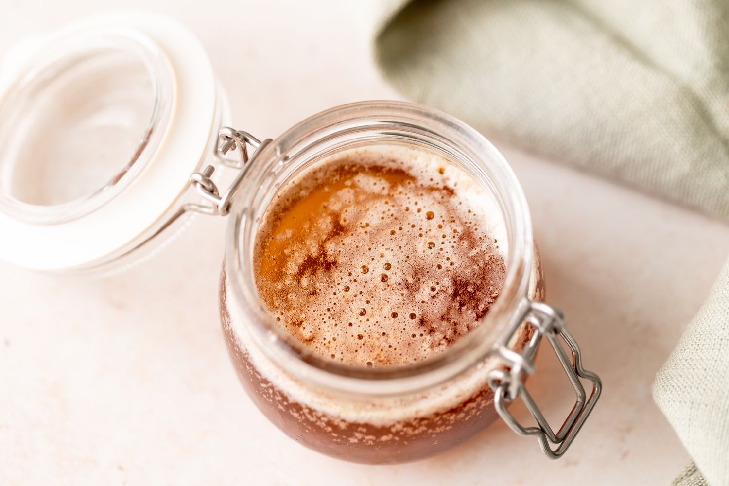 A small glass jar of brown butter sauce.