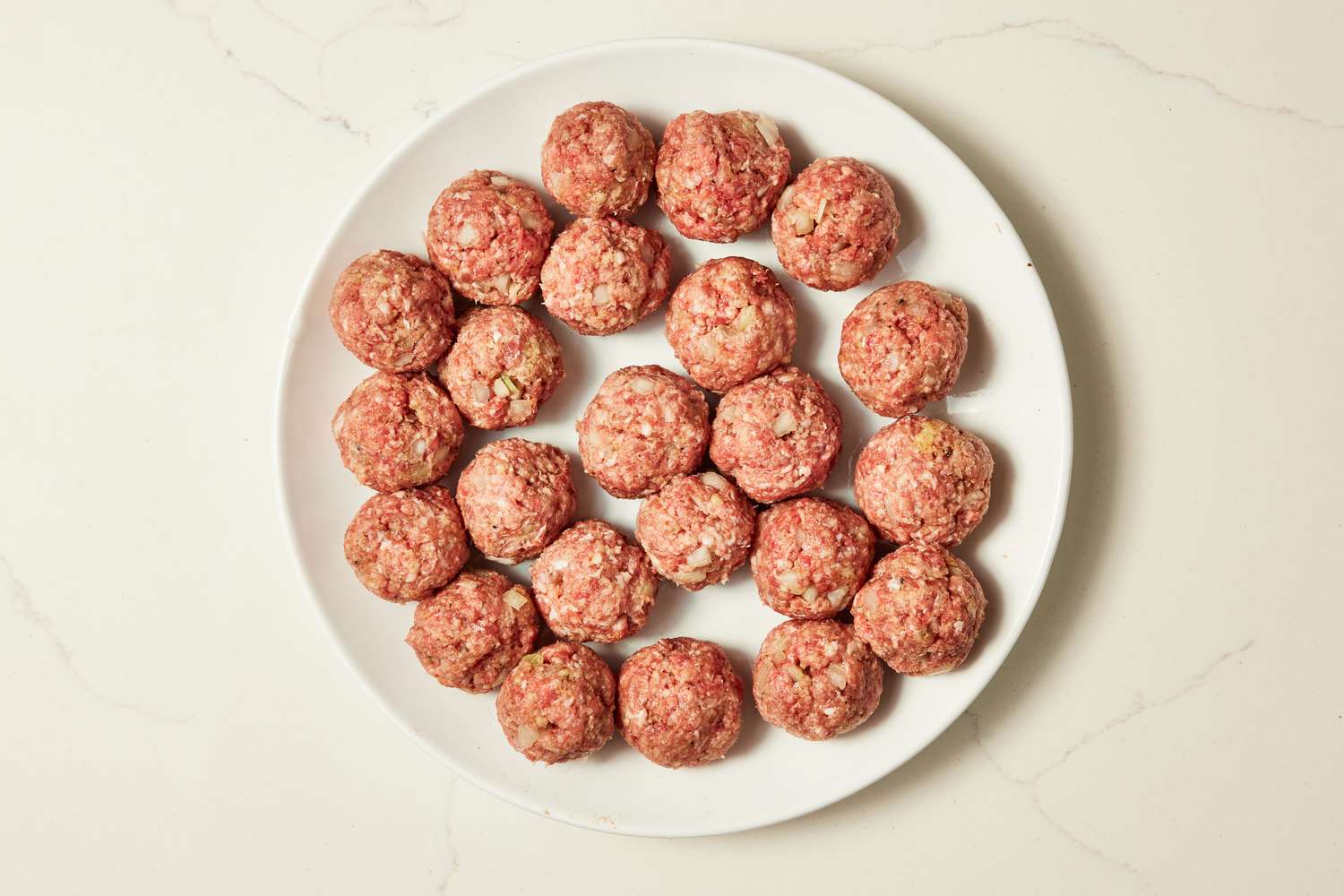 Plateful of Copycat Ikea meatball mixture after formed into meatballs