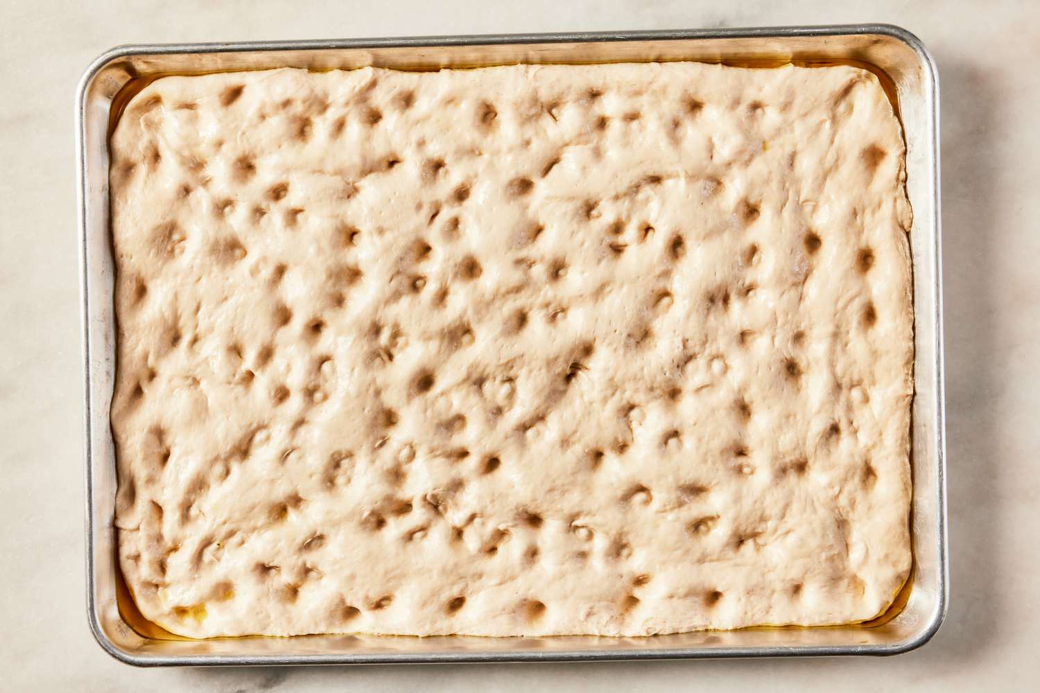 grandma pizza dough dimpled (in the sheet pan) 