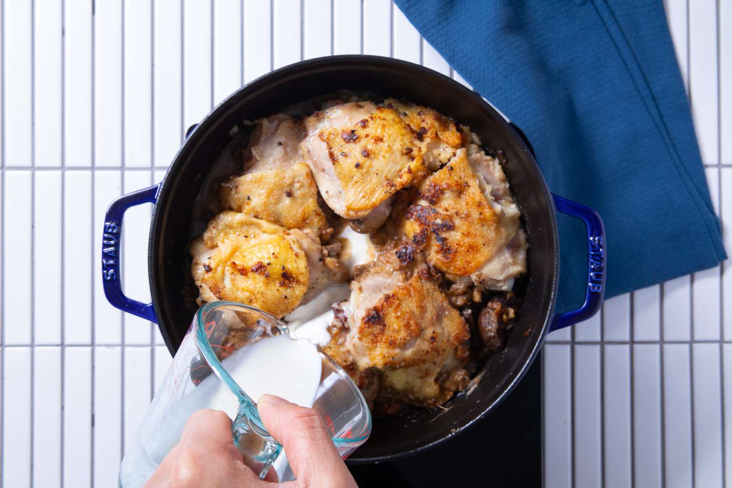 heavy cream added to dutch oven for chicken fricassee recipe