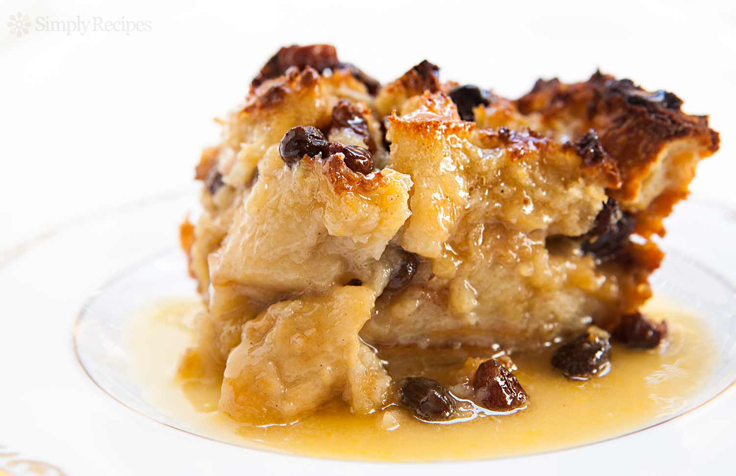 Best Bread Pudding served on a plate with bourbon sauce