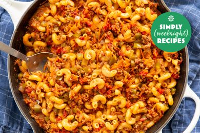 A skillet containing pasta mixed with ground meat and vegetables a labeled graphic for Simply Weeknight Recipes in one corner