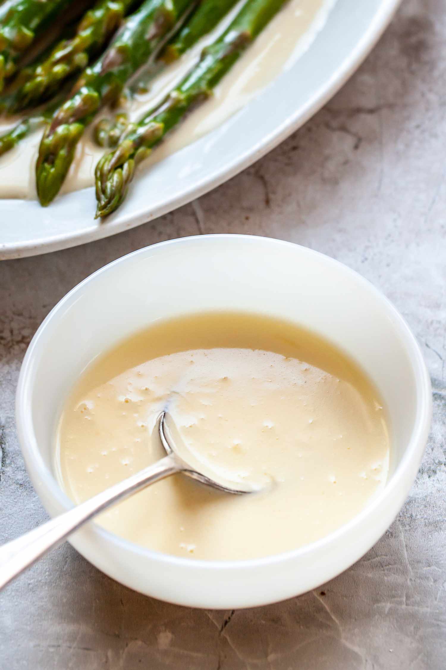 Classic beurre blanc sauce served with asparagus