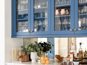 cabinets with glass doors, cups and glasses all stored neatly inside