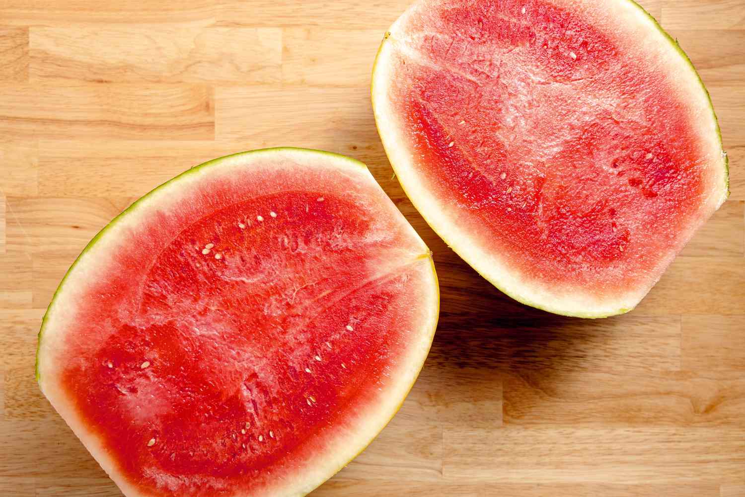 Halved watermelon, cut sides up
