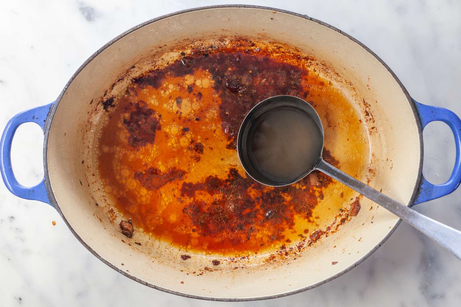 Deglazing pot with bean cooking liquid.
