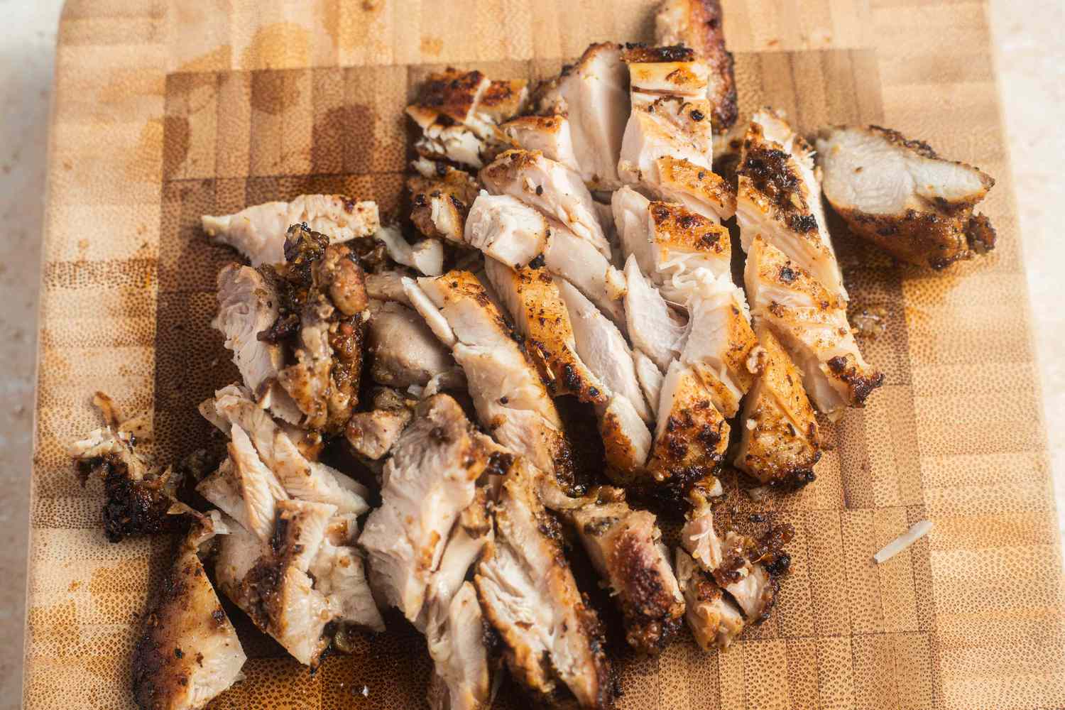 Cooked Chicken Cut Into Slices on a Cutting Board for Halal Cart Chicken Over Rice Recipe