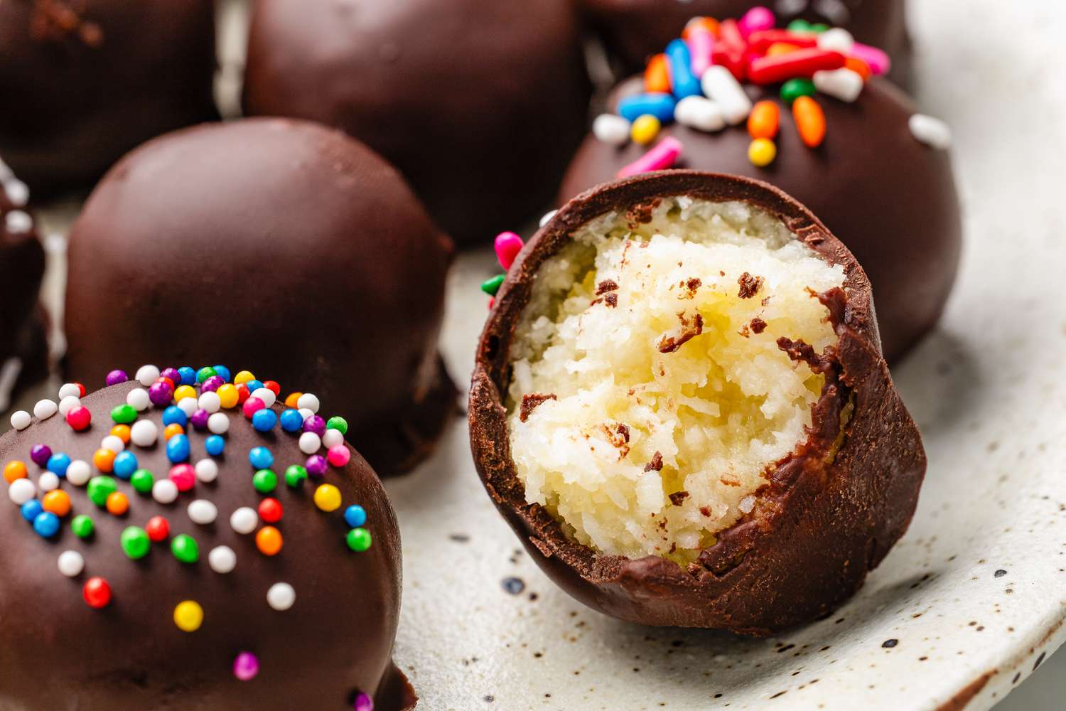 Plate of potato candy with one piece bitten into