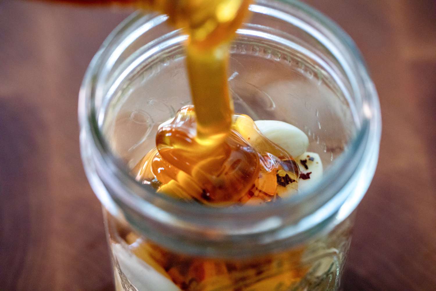 Honey Added to Half-Pint Jar for Fermented Garlic Honey 