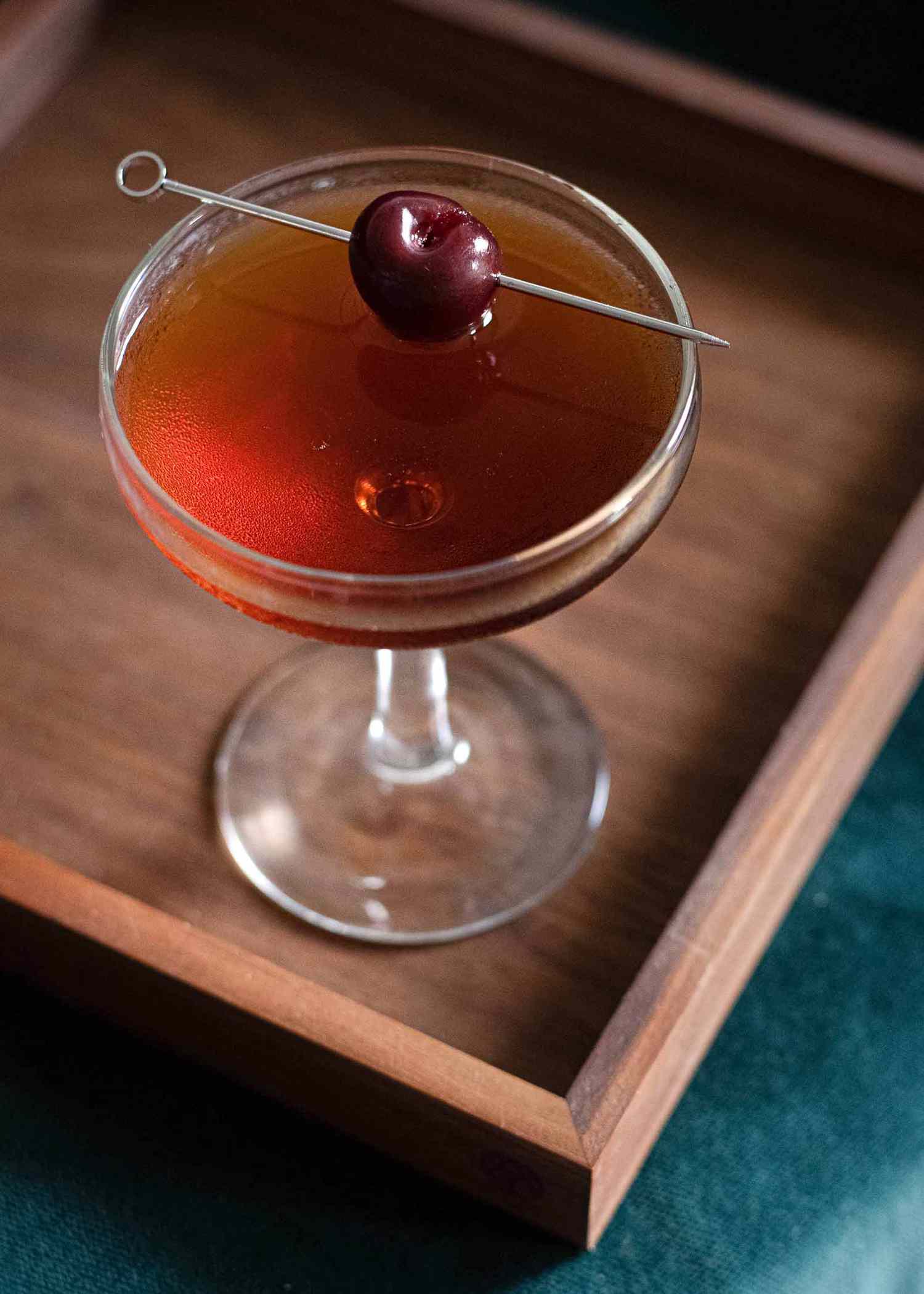 Manhattan cocktail rye whiskey, sweet vermouth, bitters in a coupe glass