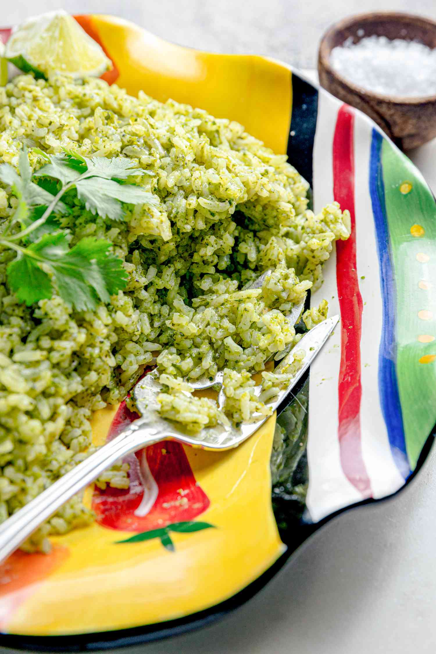 Microwave Arroz Verde on a Plate with a Fork Next to a Bowl of Coarse Salt