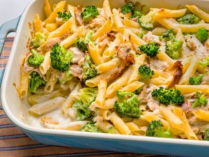 Chicken Alfredo pasta bake with broccoli in a casserole dish