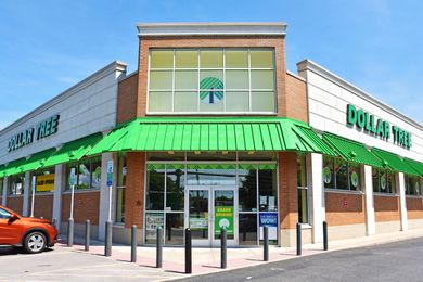 The exterior of a Dollar Tree store, featuring a brick facade and green signage