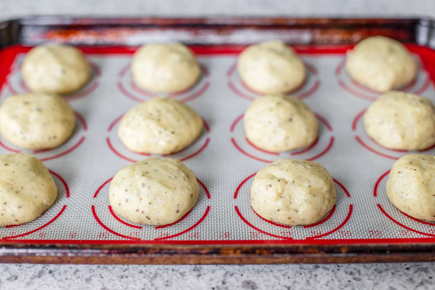 Gluten Free Dinner Rolls Shaped and Resting on a Baking Sheet
